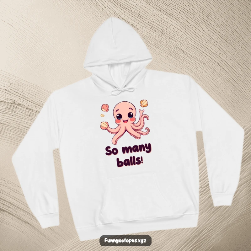 Funny hoodie showcases a joyful octopus with exaggerated googly eyes, humorously juggling seashells for maximum amusement.