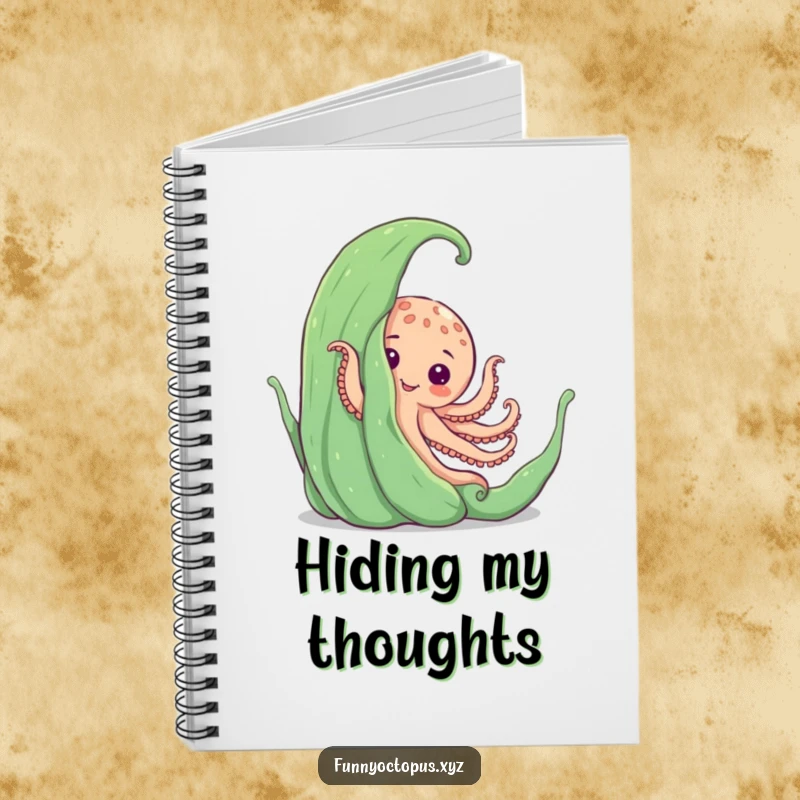 Funny notebook with an octopus playfully peeking from behind large seaweed, ideal for journaling and note-taking.